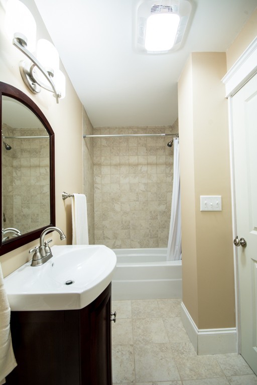 44 Bridge Street Warren, RI 02885 - Photo 23 of 30 a bathroom with a sink and a mirror