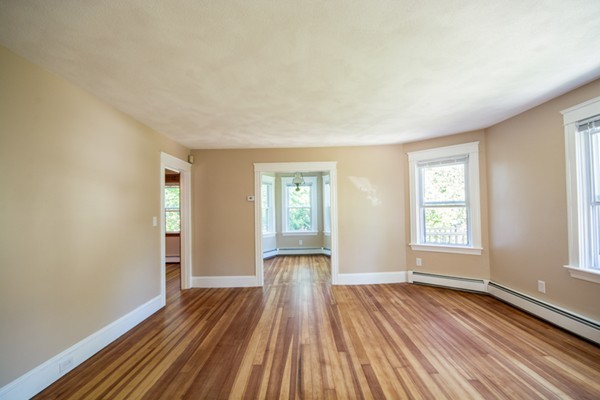44 Bridge Street Warren, RI 02885 - Photo 24 of 30 an empty room with wooden floor and windows