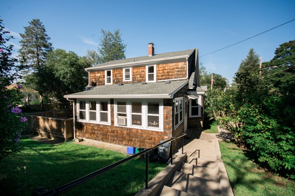 44 Bridge Street Warren, RI 02885 - Photo 3 of 30 a front view of a house with a yard