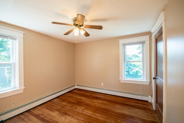 44 Bridge Street Warren, RI 02885 - Photo 6 of 30 a view of empty room with wooden floor and fan
