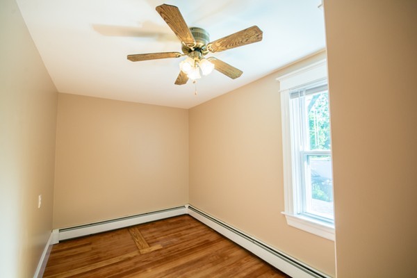 44 Bridge Street Warren, RI 02885 - Photo 8 of 30 a view of a room with wooden floor and a ceiling fan
