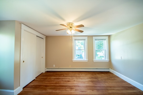 44 Bridge Street Warren, RI 02885 - Photo 10 of 30 a view of an empty room with wooden floor and a window