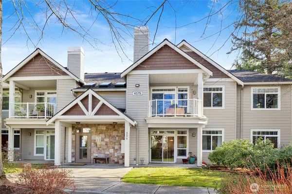 a front view of a house with yard