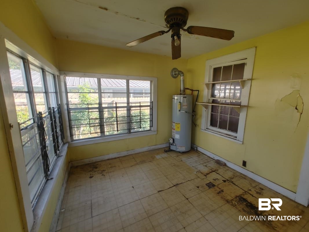 1706 Lomeroy Street Mobile, AL 36604 - Photo 22 of 24 Unfurnished sunroom with secured water heater and plenty of natural light
