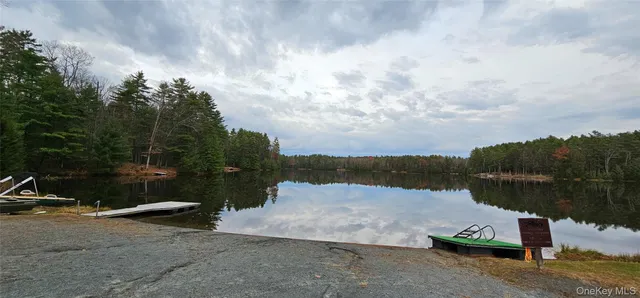 a view of lake with mountain in background