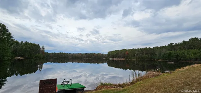 a sign that is sitting on a wooden wall