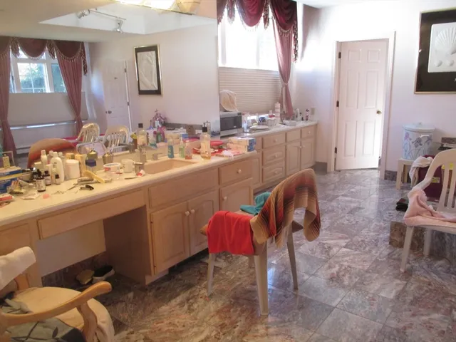 a kitchen with a sink cabinets and appliances