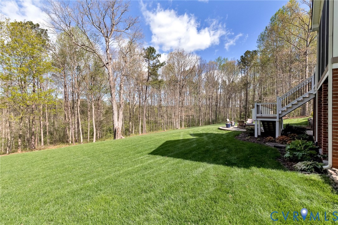 14436 Overlook Ridge Lane Beaverdam, VA 23015 - Photo 67 of 82 a backyard of a house with lots of green space
