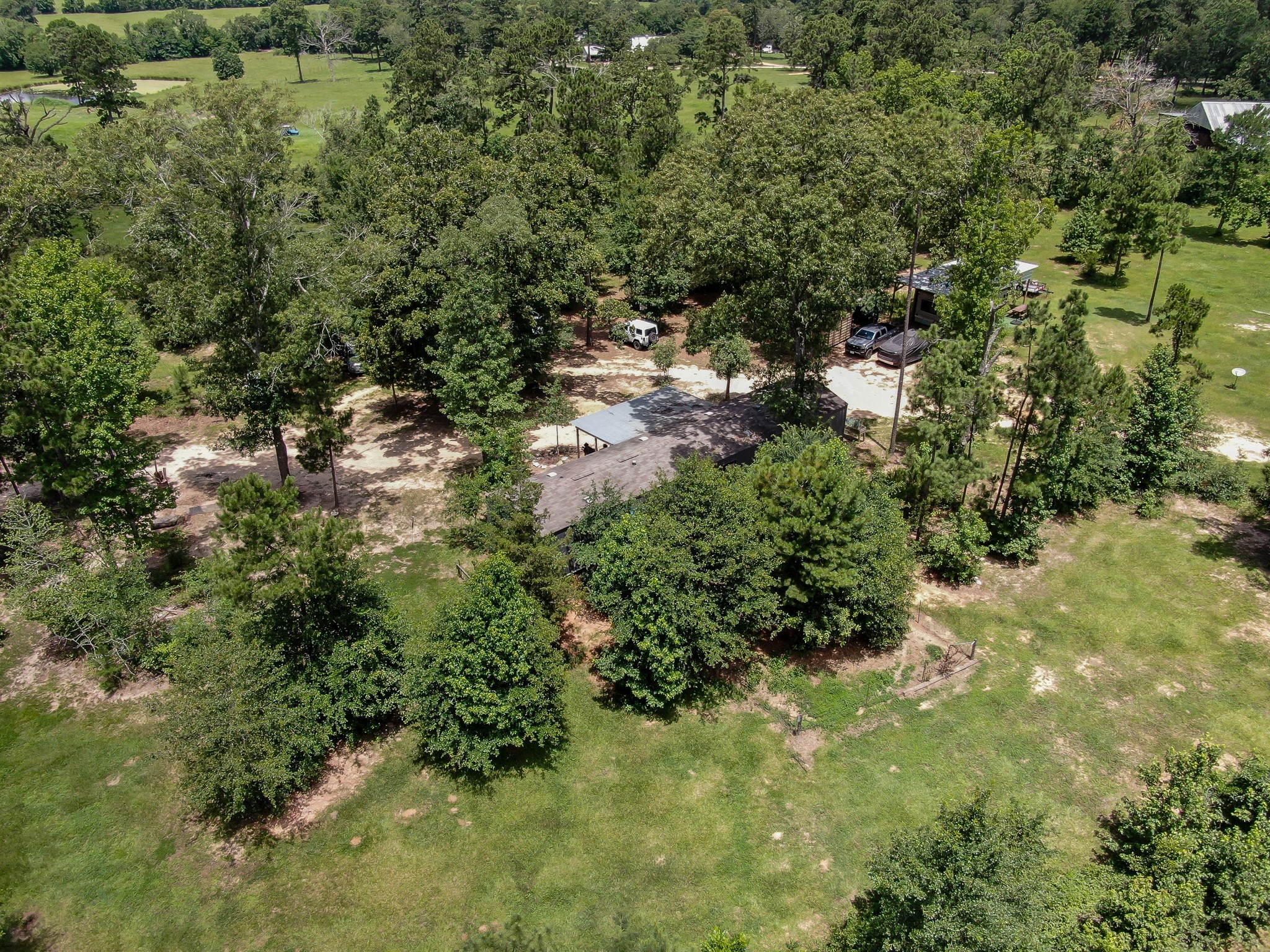 400 Raven Hill Road Oakhurst, TX 77359 - Photo 33 of 45 a view of a forest with a houses