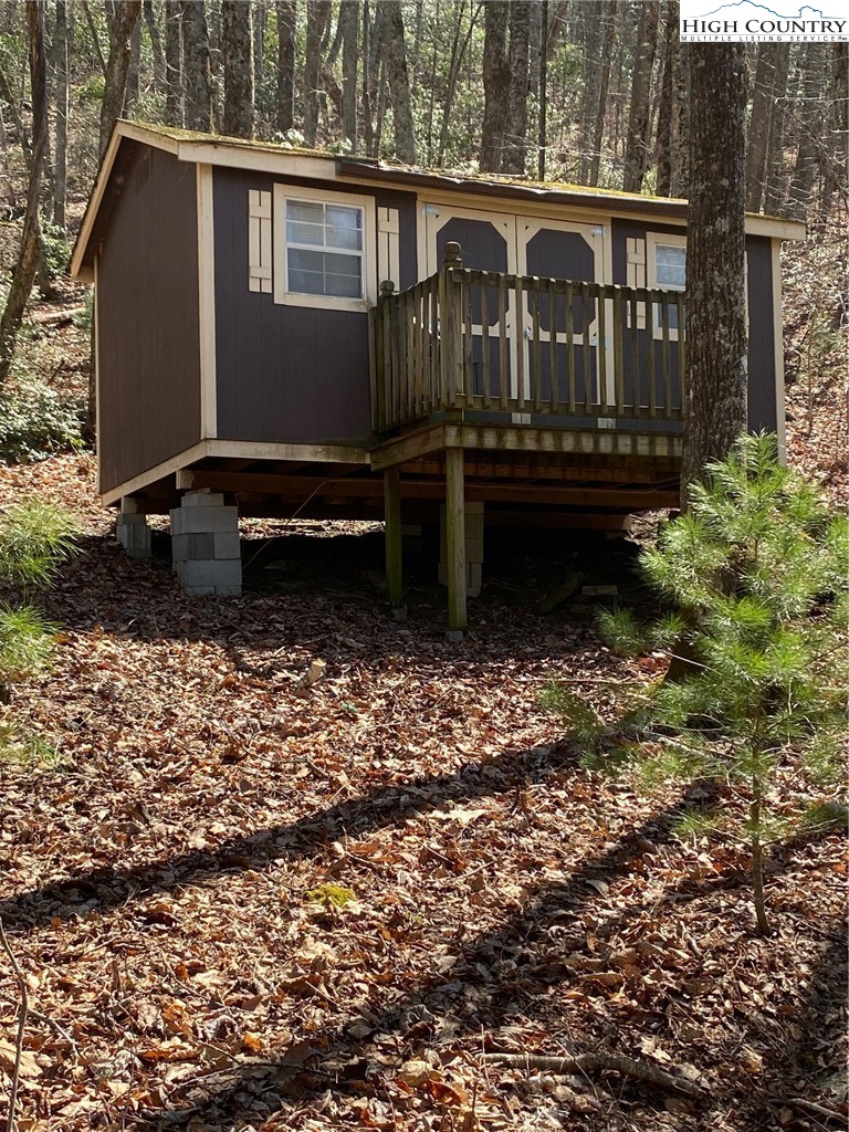 Starmount Lane Sparta, NC 28675 - Photo 2 of 20 a view of a wooden house with a yard