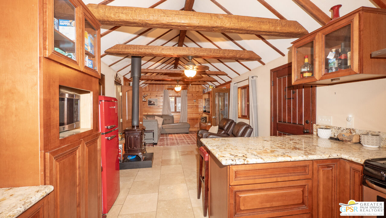 76 7 Oaks Road Angelus Oaks, CA 92305 - Photo 9 of 35 a view of a living room and kitchen