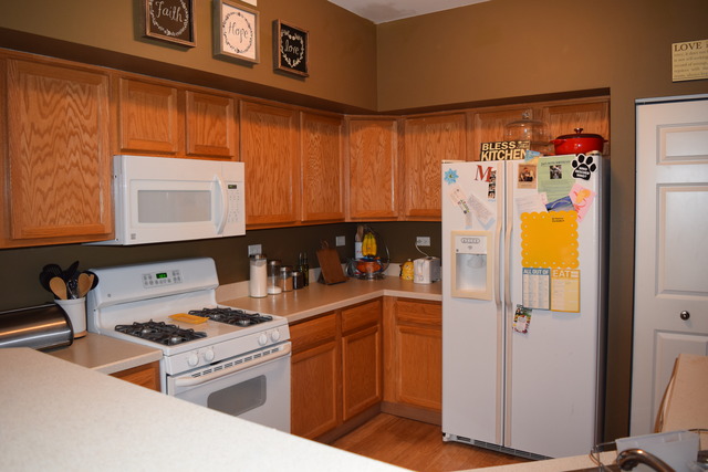 2370 Georgetown Circle, Unit 2370 Aurora, IL 60503 - Photo 11 of 21 a kitchen with stainless steel appliances granite countertop a refrigerator and a stove top oven