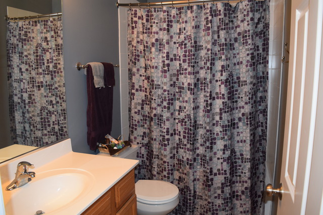 2370 Georgetown Circle, Unit 2370 Aurora, IL 60503 - Photo 16 of 21 a bathroom with a sink toilet and shower