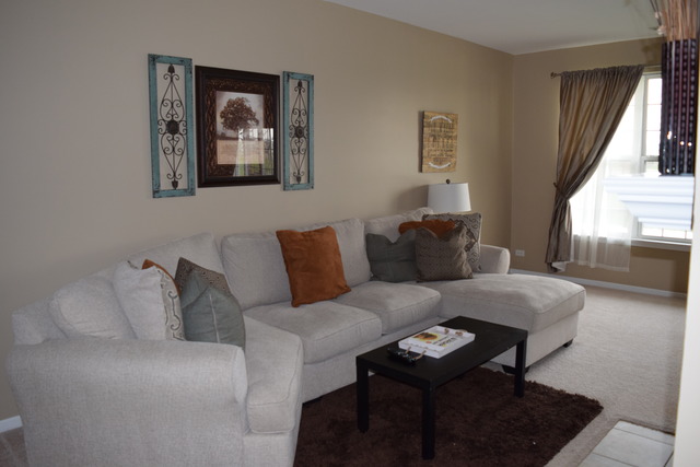2370 Georgetown Circle, Unit 2370 Aurora, IL 60503 - Photo 4 of 21 a living room with furniture and a window