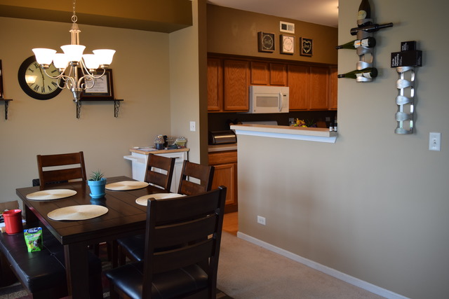 2370 Georgetown Circle, Unit 2370 Aurora, IL 60503 - Photo 7 of 21 a view of a dining room with furniture