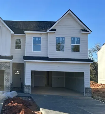 a front view of a house with yard