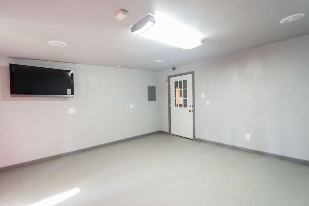 201 Red Oak Road Byron, GA 31008 - Photo 22 of 29 an empty room with windows and fireplace