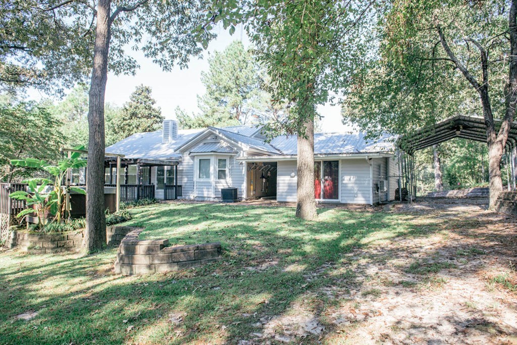 201 Red Oak Road Byron, GA 31008 - Photo 26 of 29 a front view of a house with a garden