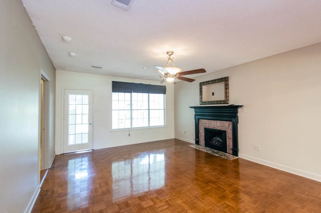 201 Red Oak Road Byron, GA 31008 - Photo 4 of 29 wooden floor fireplace and windows in an empty room