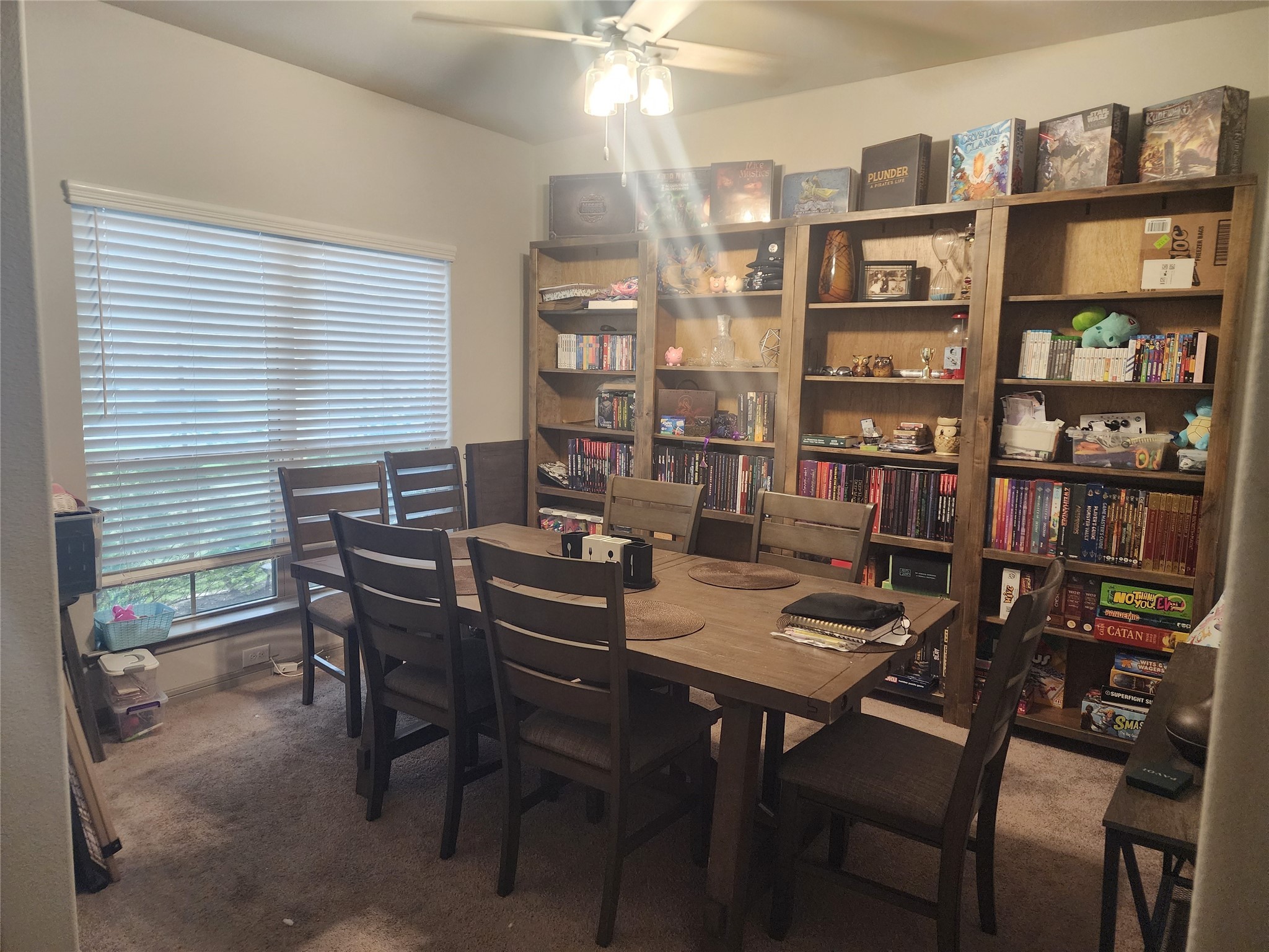 15611 Jackie Robinson Road Splendora, TX 77372 - Photo 2 of 6 Dining room is complemented by natural light from a large front window with blinds and a ceiling fan provides ventilation.