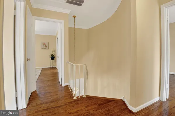 a living room with furniture rug and wooden floor