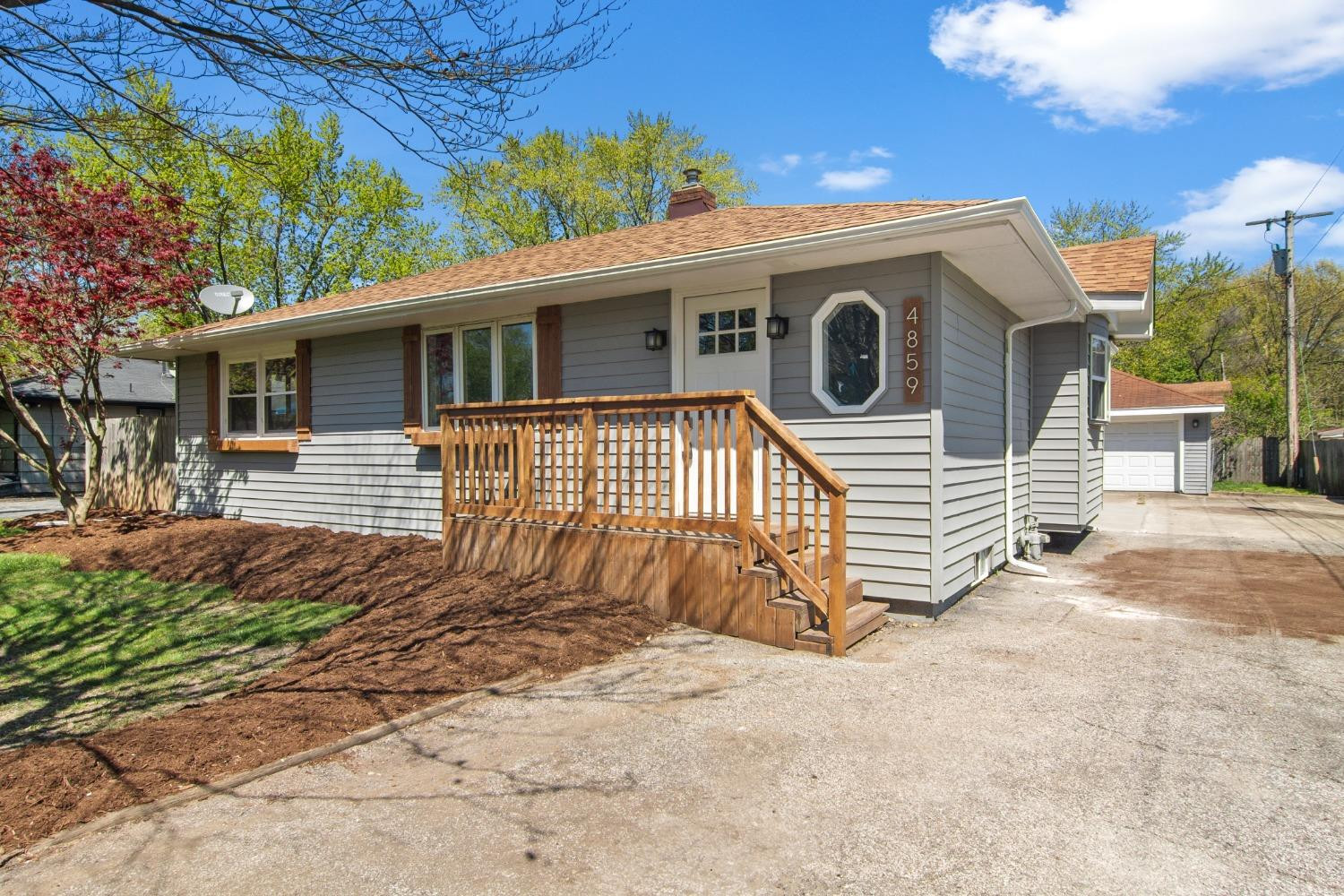 4895 Cherry Street Griffith, IN 46319 - Photo 2 of 21 a front view of a house with a garage