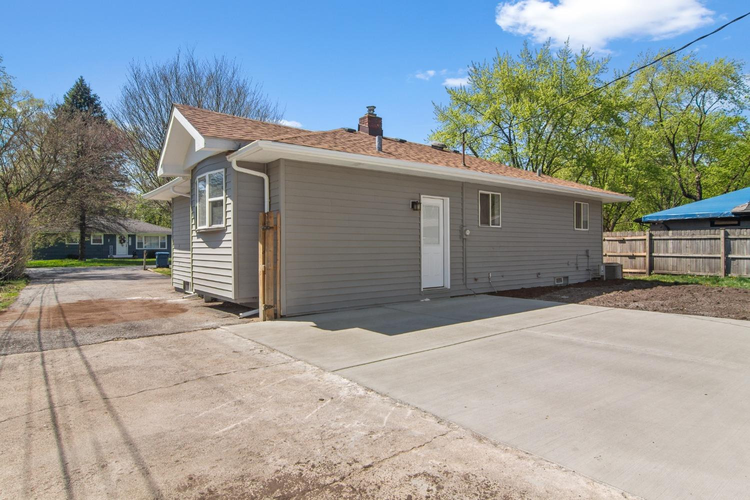 4895 Cherry Street Griffith, IN 46319 - Photo 8 of 21 a view of house with garage and trees