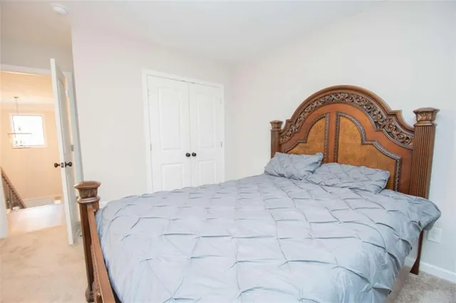 a bedroom with a bed and a mirror