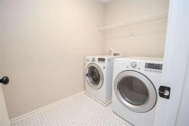a utility room with dryer and washer