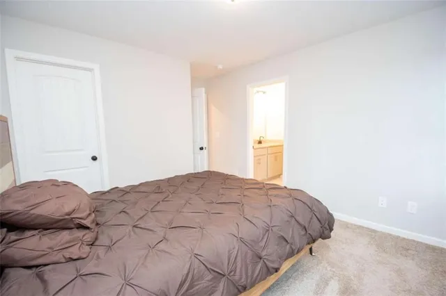 a bedroom with a bed and a cabinets