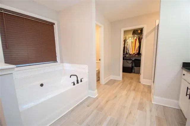 a bathroom with a bathtub and a shower