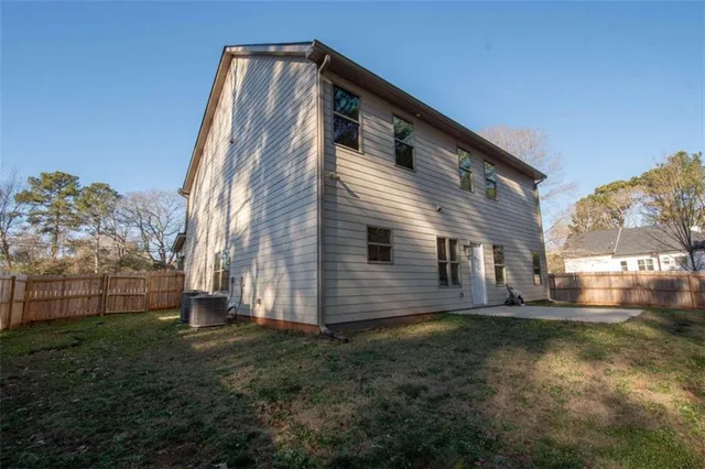 a backyard of a house with lots of green space