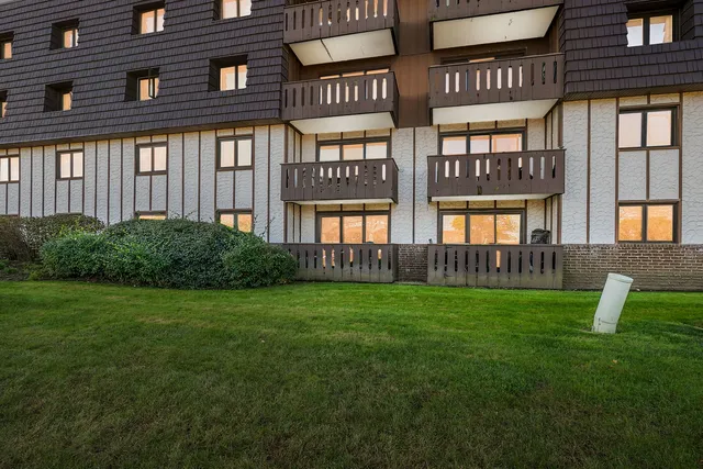a view of an apartment with a garden