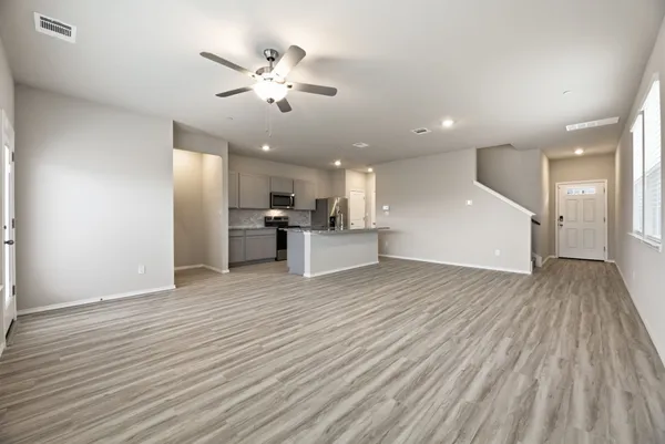a view of kitchen with furniture and wooden floor