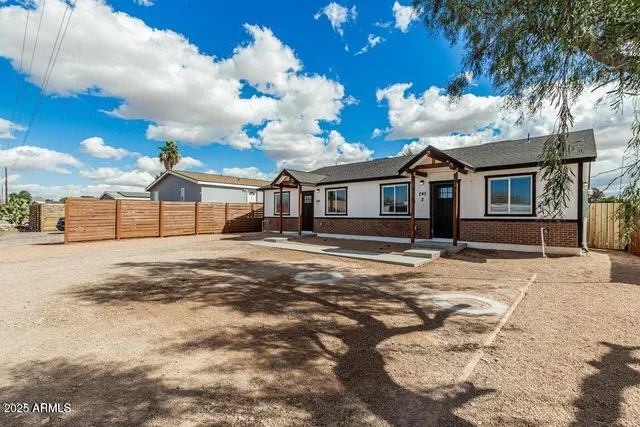 a view of a house with a snow on the road