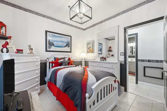 a bedroom with a bed and a view of kitchen