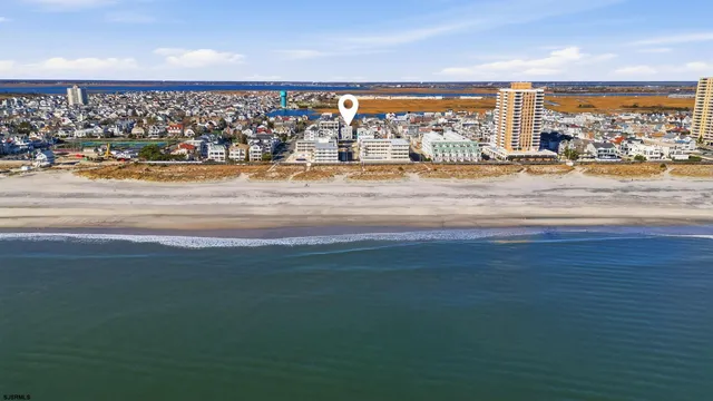 an aerial view of multiple house with yard