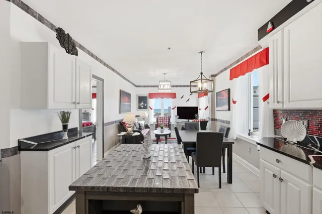 a very nice looking living room with a dining table and chairs