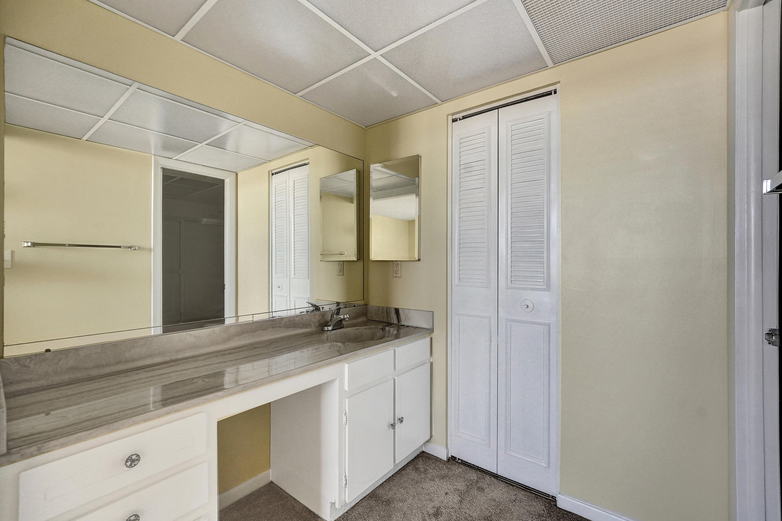12 Royal Palm Way, Unit 6020 Boca Raton, FL 33432 - Photo 14 of 69 a bathroom with a sink and a mirror