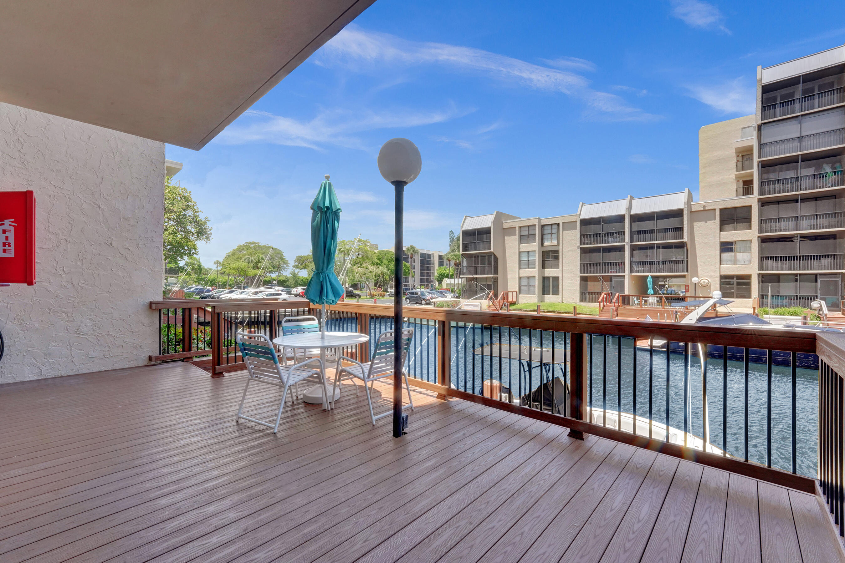 12 Royal Palm Way, Unit 6020 Boca Raton, FL 33432 - Photo 31 of 69 a view of a chairs and table on the wooden deck