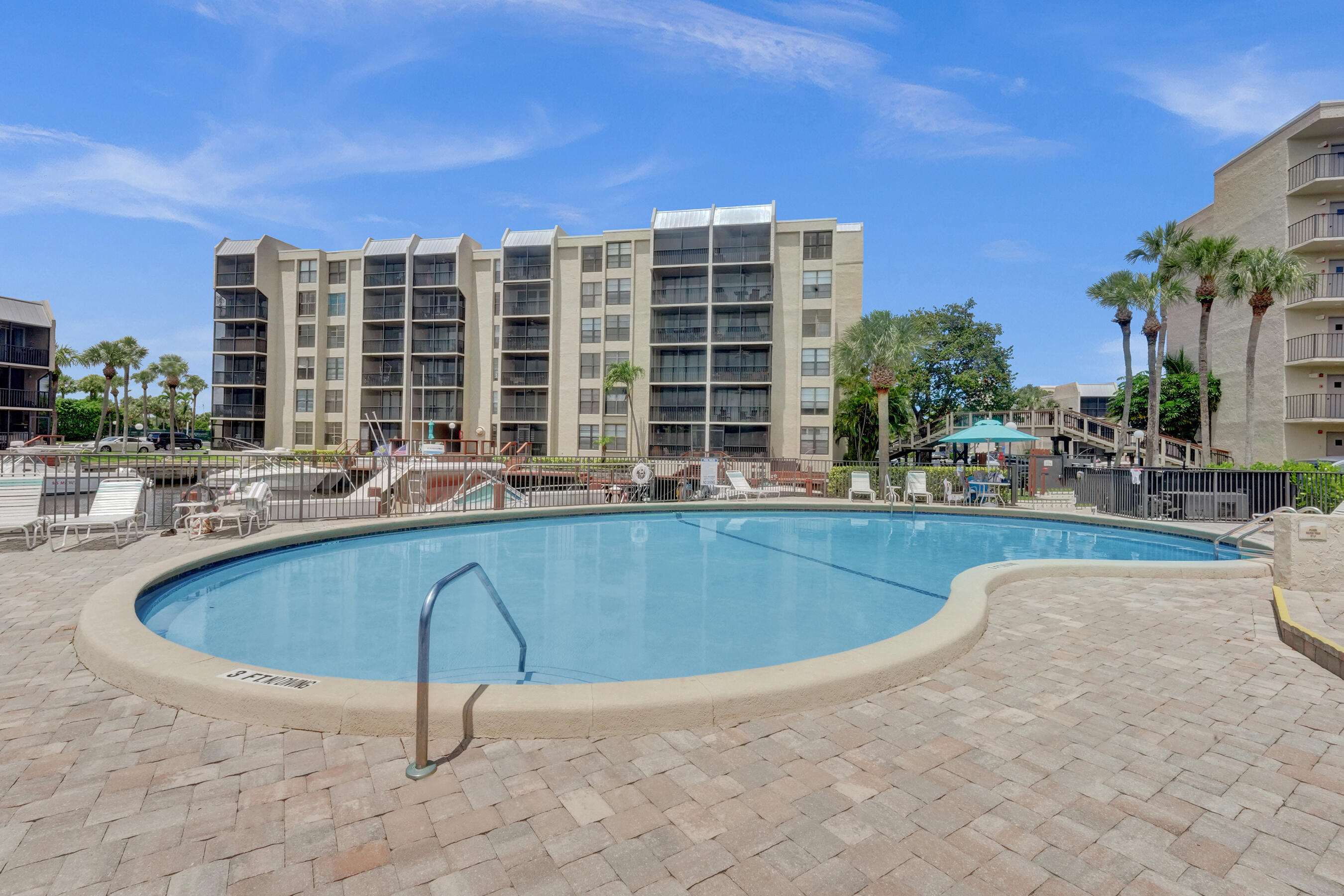 12 Royal Palm Way, Unit 6020 Boca Raton, FL 33432 - Photo 43 of 69 a swimming pool with outdoor seating and yard