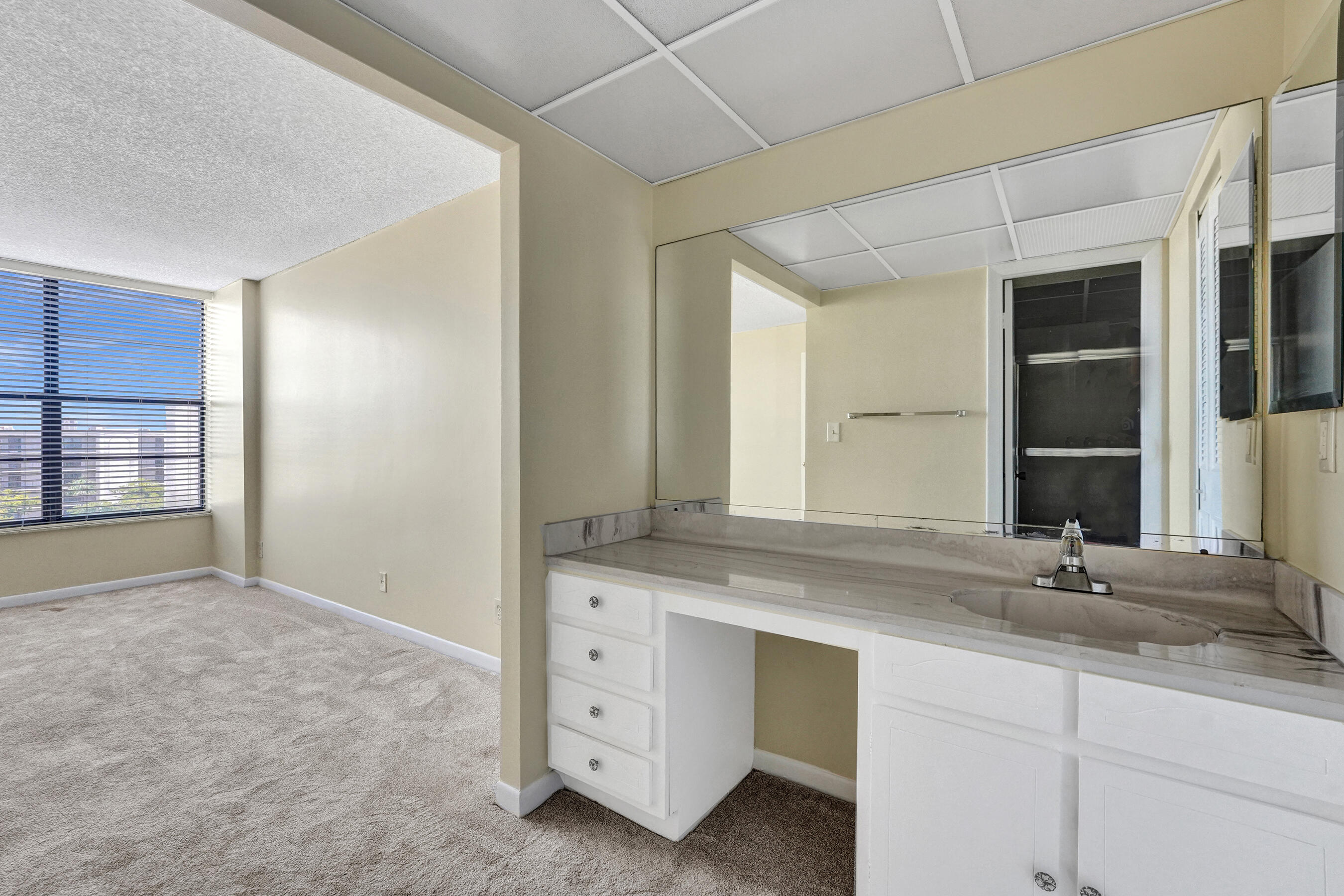 12 Royal Palm Way, Unit 6020 Boca Raton, FL 33432 - Photo 68 of 69 a bathroom with a sink and a mirror