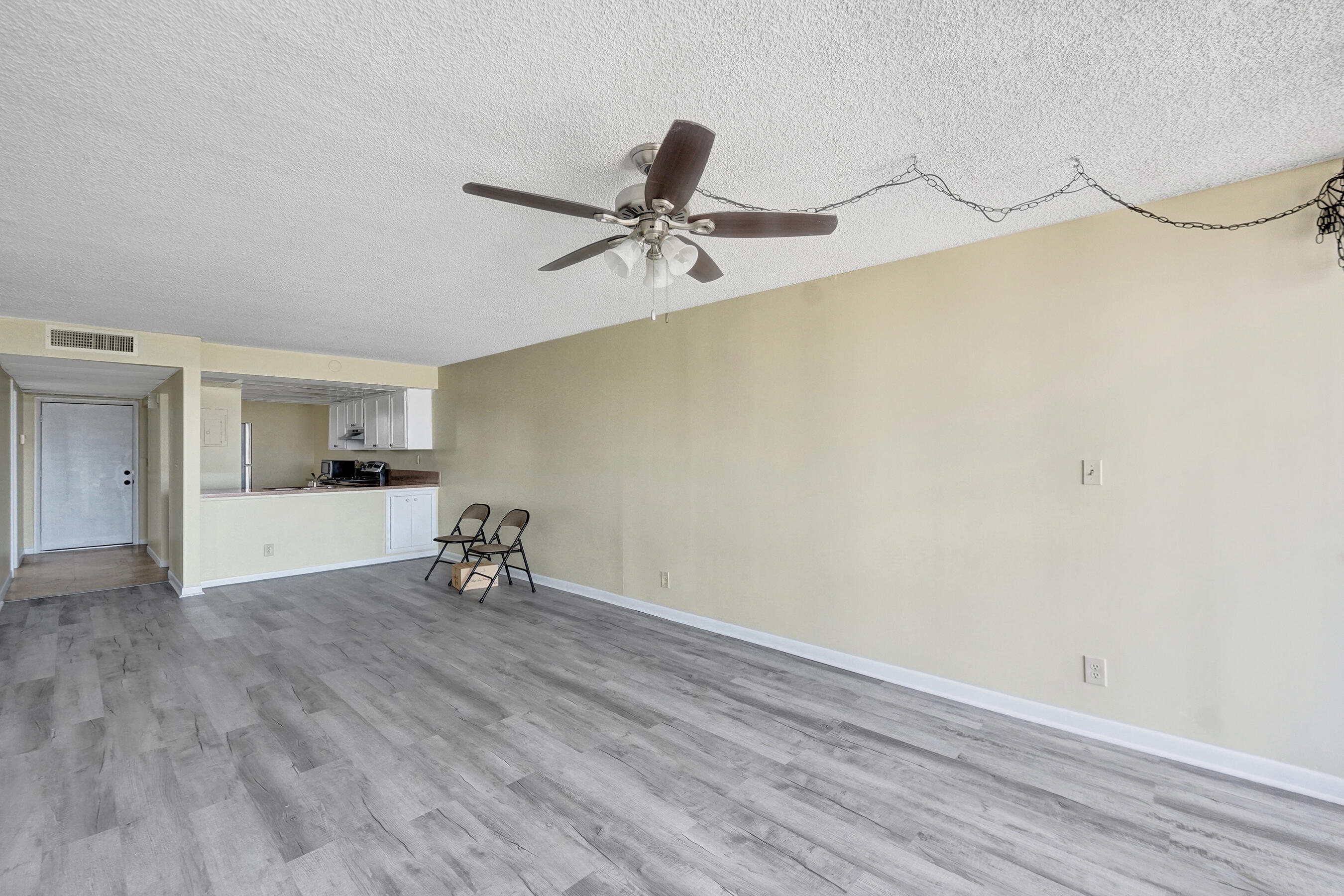 12 Royal Palm Way, Unit 6020 Boca Raton, FL 33432 - Photo 7 of 69 a view of an empty room with a window and wooden floor