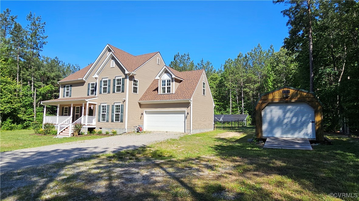 1290 Schutt Road Crewe, VA 23930 - Photo 3 of 50 a front view of a house with a garden