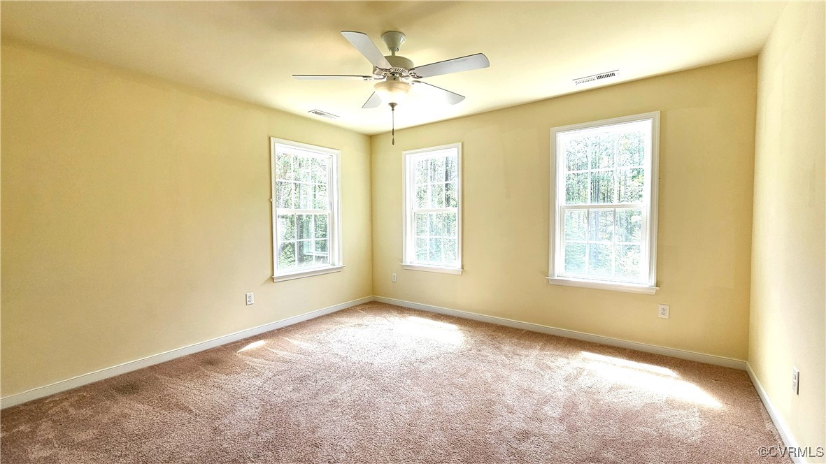 1290 Schutt Road Crewe, VA 23930 - Photo 42 of 50 a view of an empty room with chandelier fan and a large window