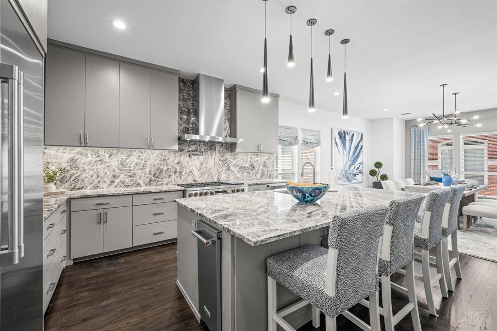 2214 Allen Street, Unit A Dallas, TX 75204 - Photo 16 of 36 a kitchen with stainless steel appliances granite countertop a sink a stove a dining table and chairs
