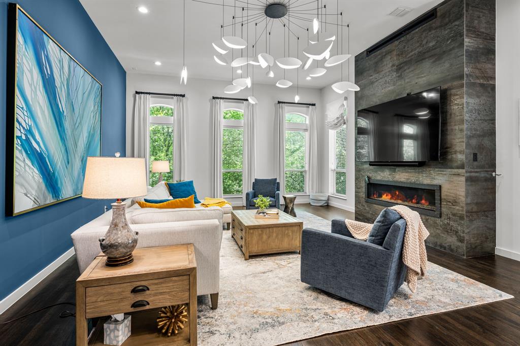 2214 Allen Street, Unit A Dallas, TX 75204 - Photo 2 of 36 a living room with fireplace furniture and a flat screen tv