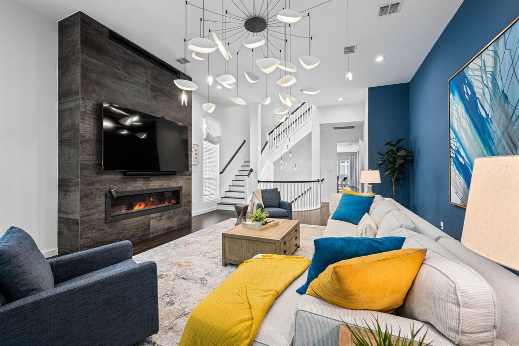 2214 Allen Street, Unit A Dallas, TX 75204 - Photo 5 of 36 a living room with furniture and a flat screen tv