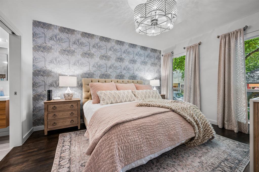 2214 Allen Street, Unit A Dallas, TX 75204 - Photo 8 of 36 a bedroom with a bed and a chandelier
