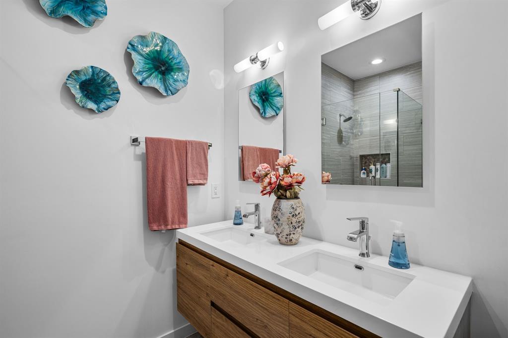 2214 Allen Street, Unit A Dallas, TX 75204 - Photo 10 of 36 a bathroom with a sink vanity and mirror